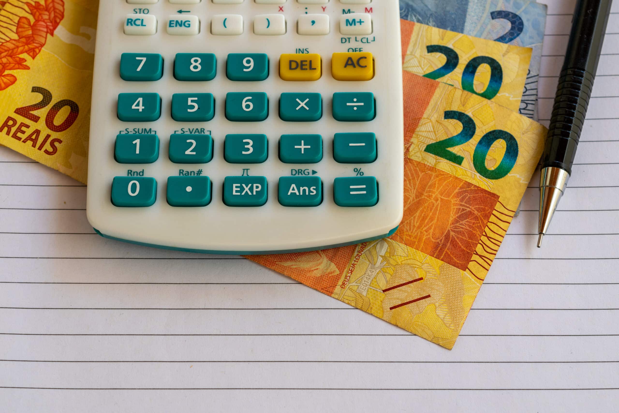 calculator-brazilian-money-bills-sheet-paper-with-mechanical-pencil-scaled.jpg calculator-brazilian-money-bills-sheet-paper-with-mechanical-pencil-scaled.jpg