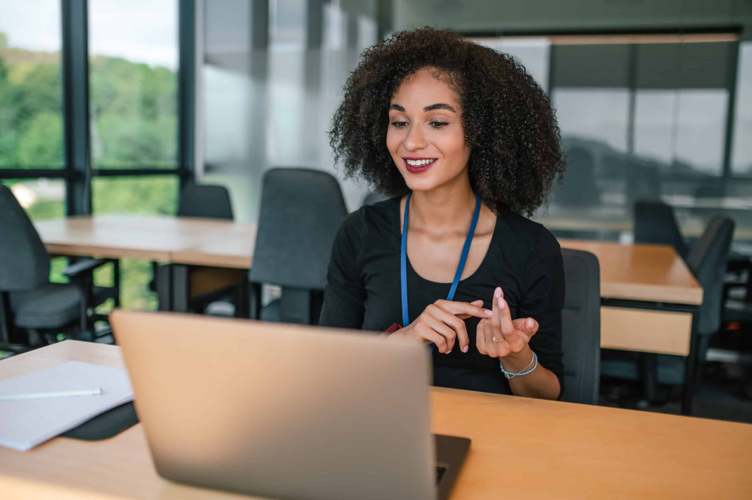 pretty-young-woman-sitting-table-having-video-call-scaled.jpg
