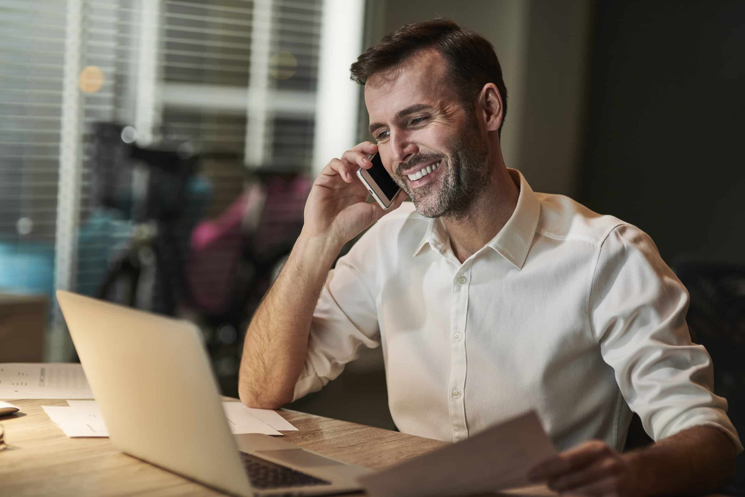 smiling-businessman-talking-by-mobile-phone-scaled.jpg smiling-businessman-talking-by-mobile-phone-scaled.jpg